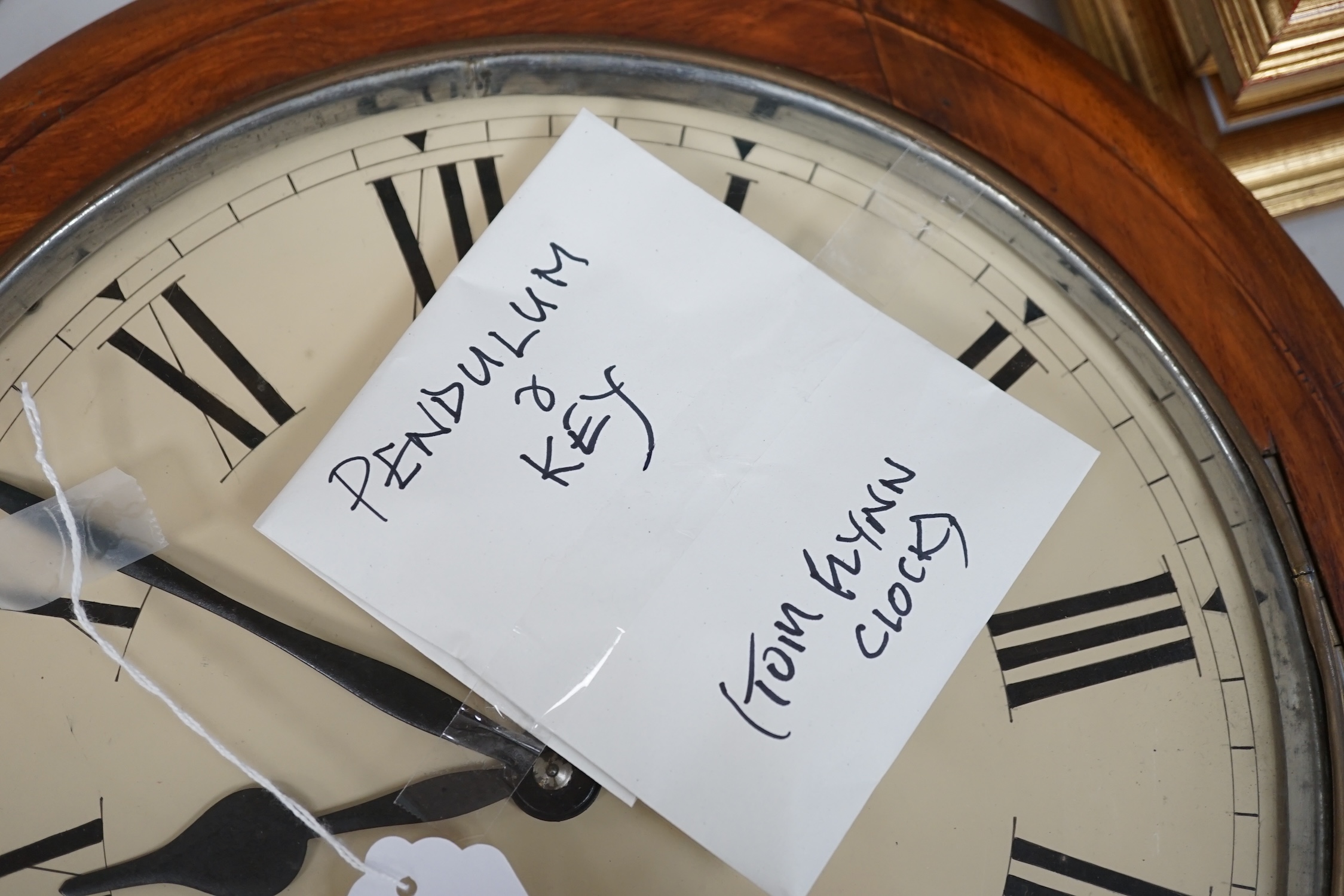 A Victorian mahogany circular dial eight day wall timepiece, with a spring driven movement and a white enamelled dial with Roman numerals, diameter 40cm